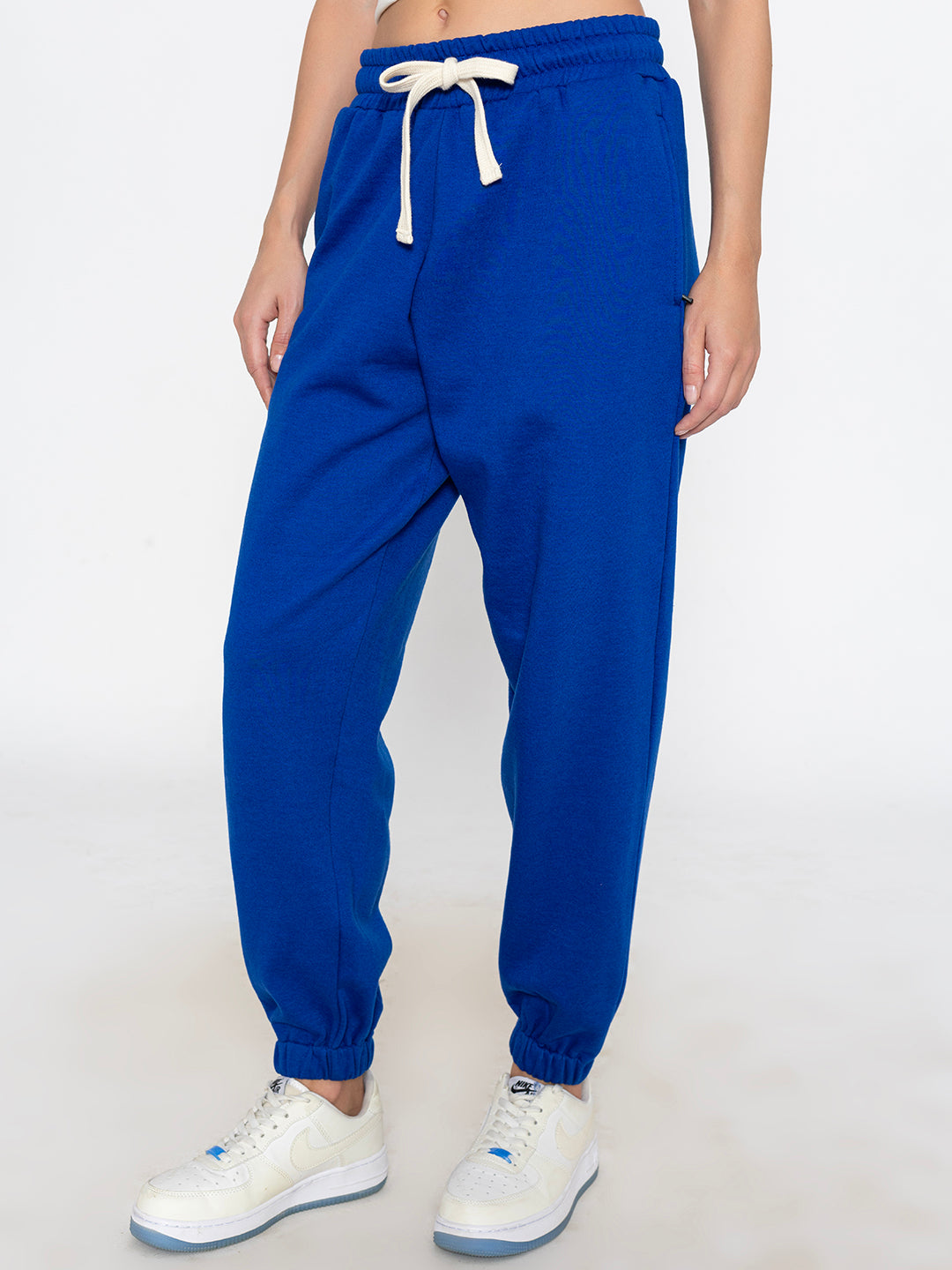 Close-up of elastic waistband on blue joggers