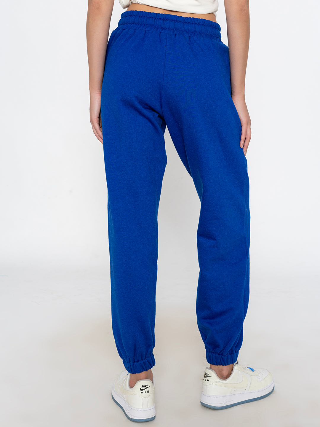 Detail of side pocket on blue cotton blend joggers