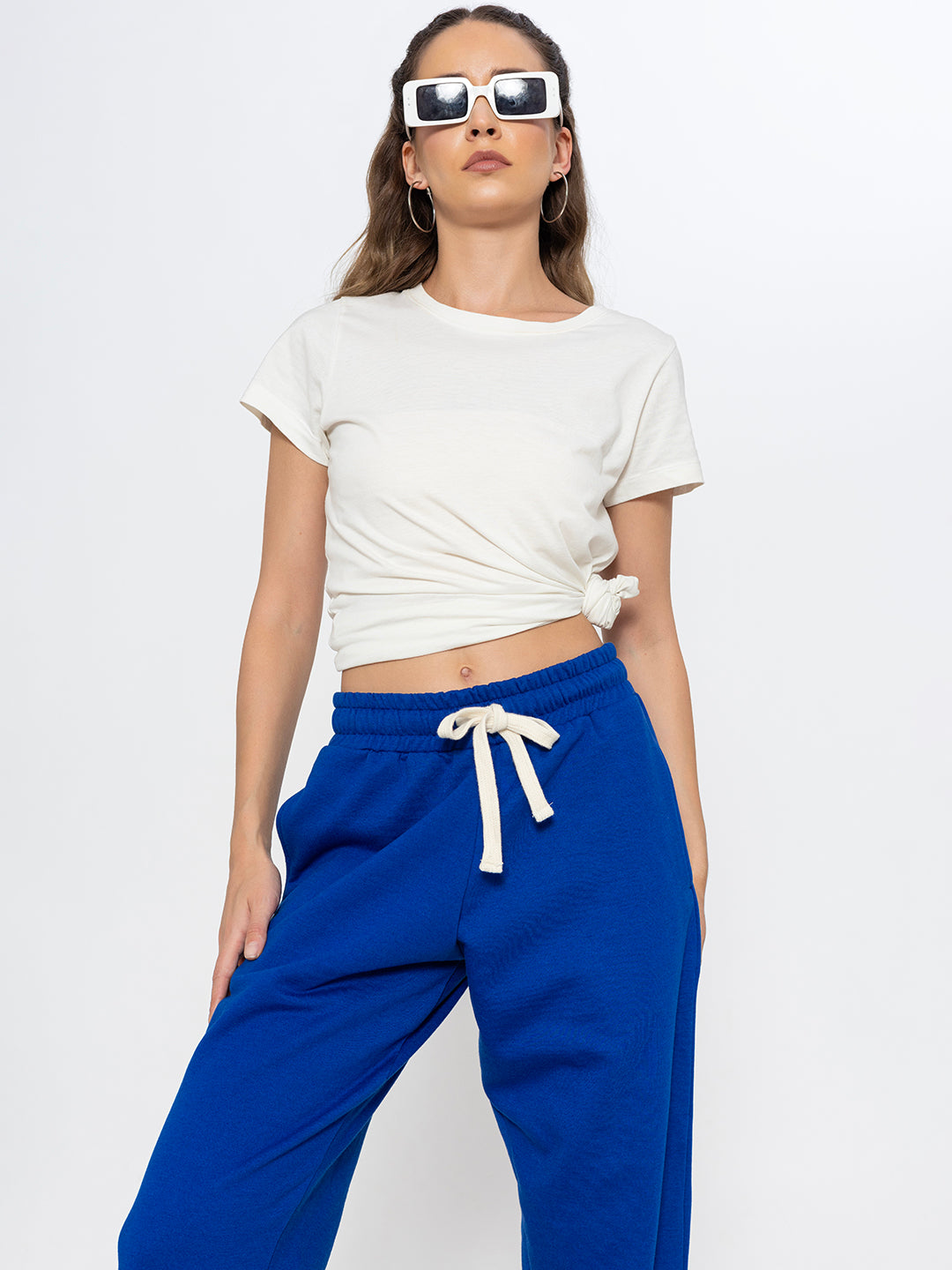 Blue joggers shown in soft natural daylight