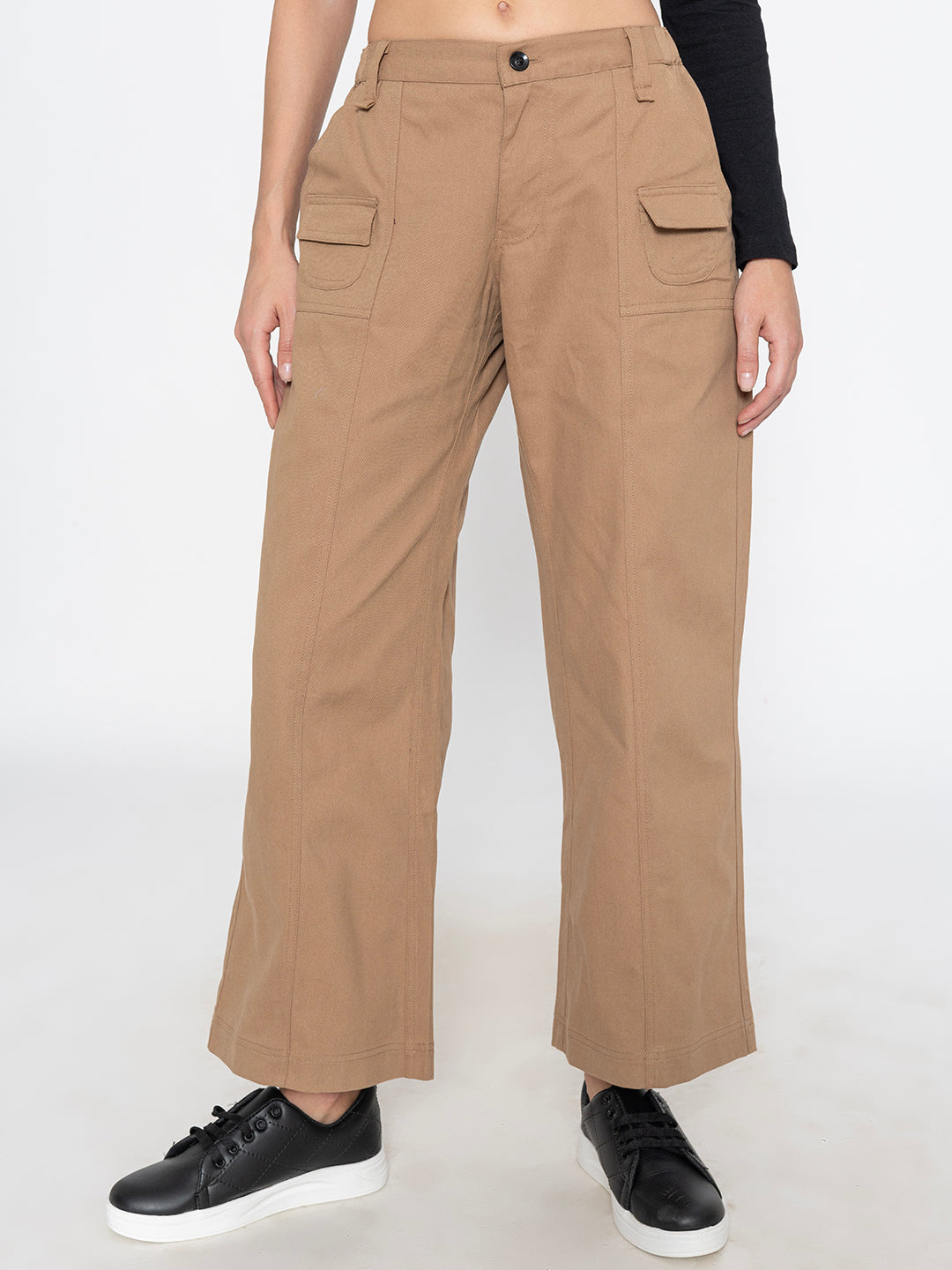Front view of beige cotton baggy trousers for women