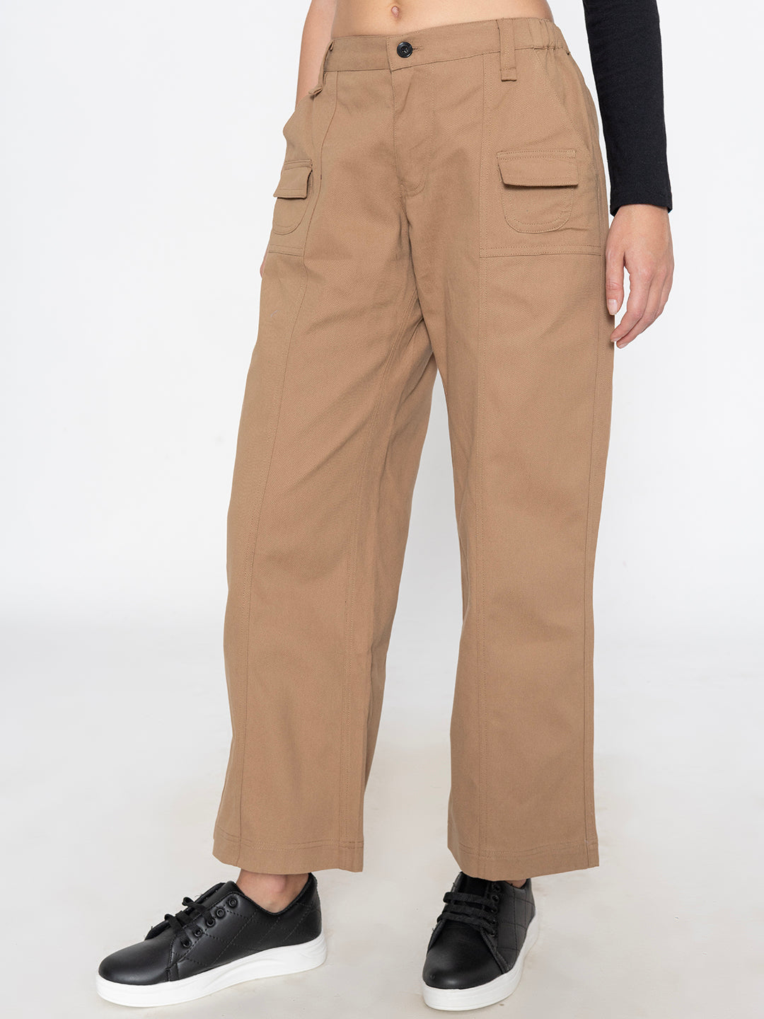 Back view of beige baggy trousers with relaxed fit