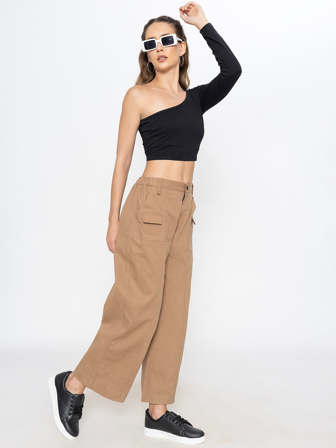 Close-up of elastic waistband on beige cotton trousers