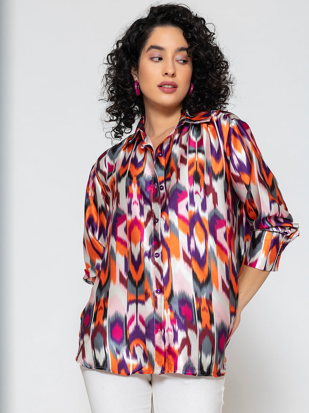 Close-up of vibrant Atik print pattern on satin fabric