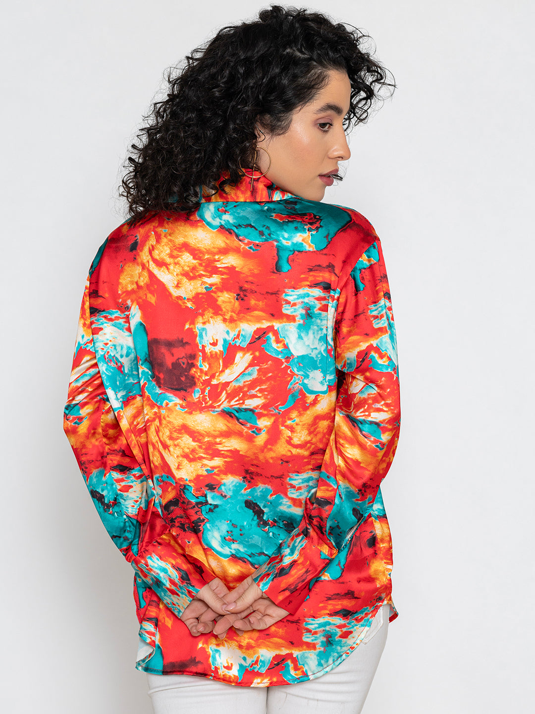 Close-up of floral print pattern on red satin fabric