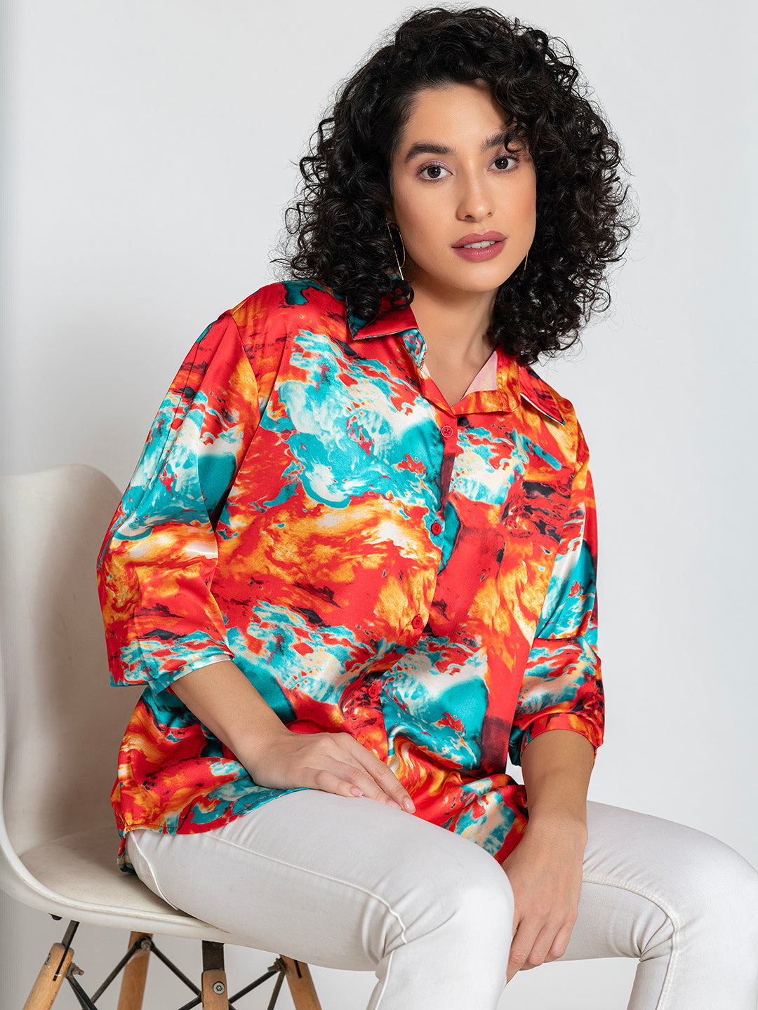 Curved hemline detail on red printed satin relaxed-fit shirt