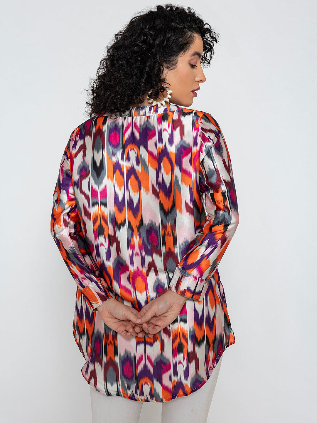 Close-up of vibrant Atik print on satin kurta fabric