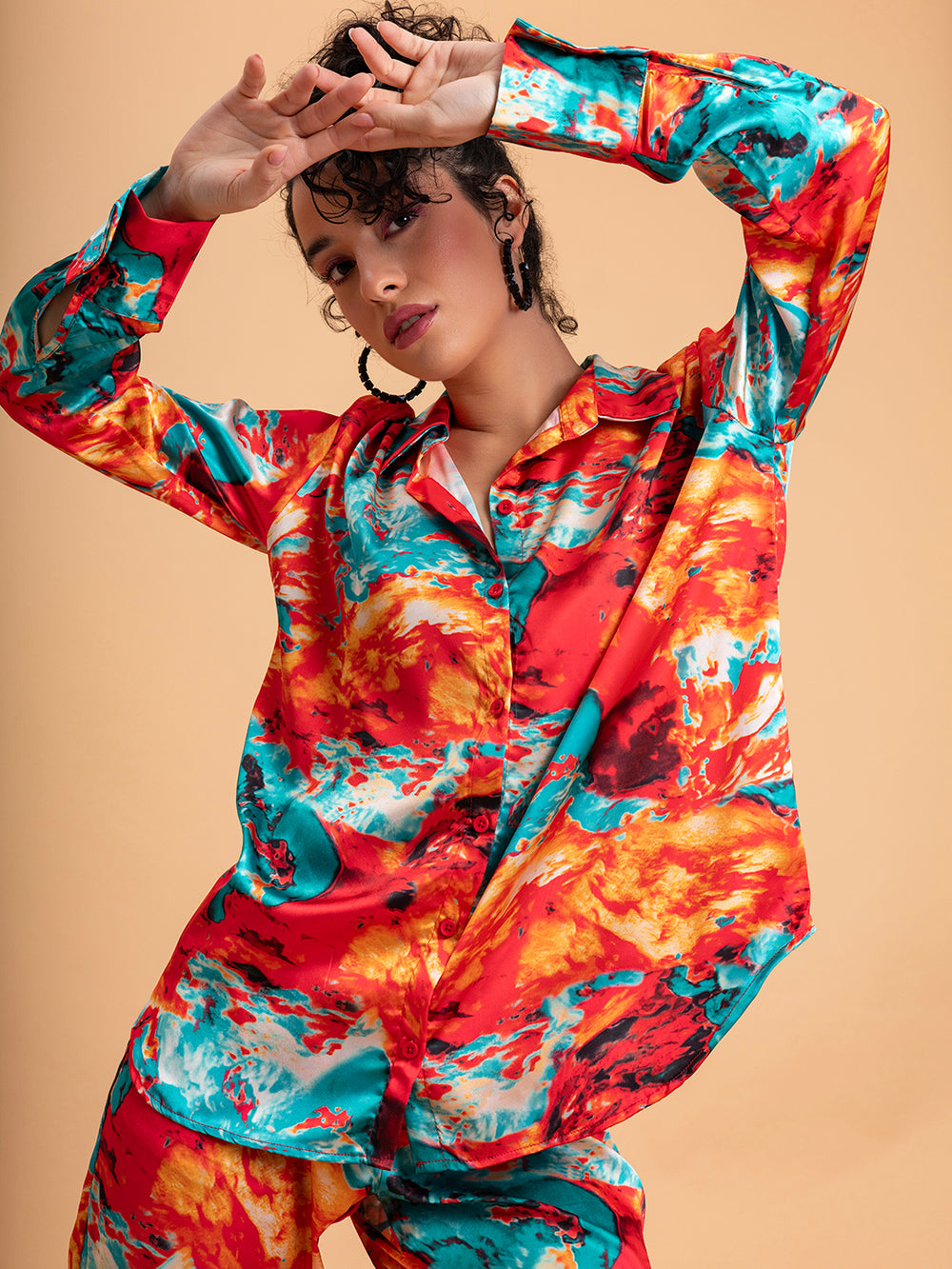 Side view of red printed satin co-ord top and trouser
