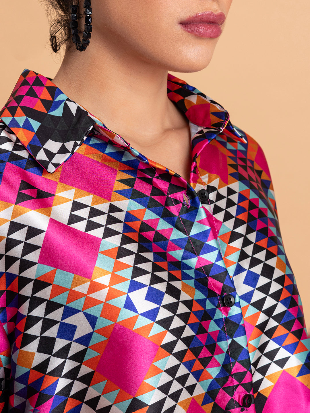 Lifestyle shot of multicolor floral satin co-ord styled with heels