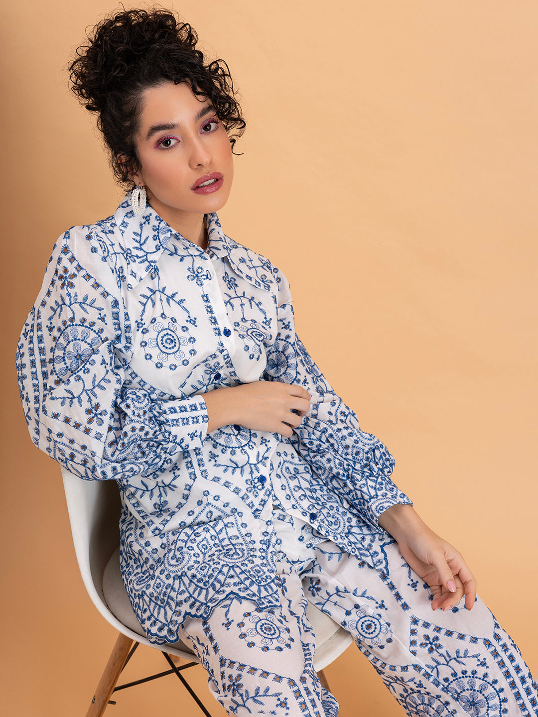 Top portion detail of white pure cotton schiffli embroidered co-ord