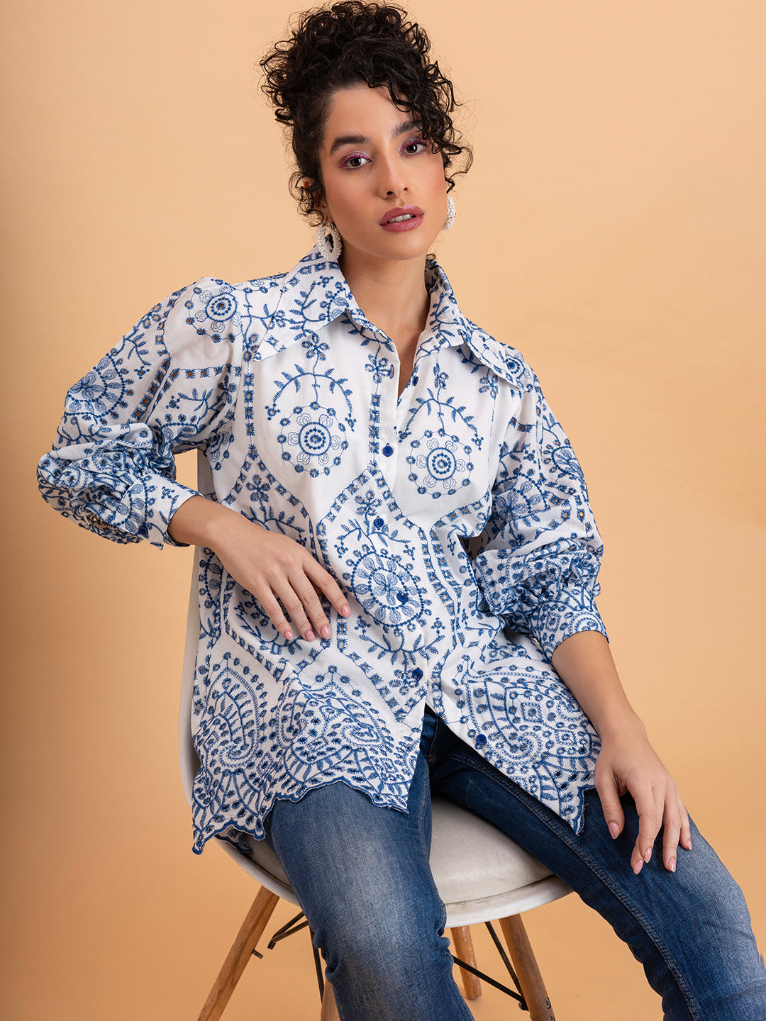 Curved hemline and side slits detail on white pure cotton embroidered shirt