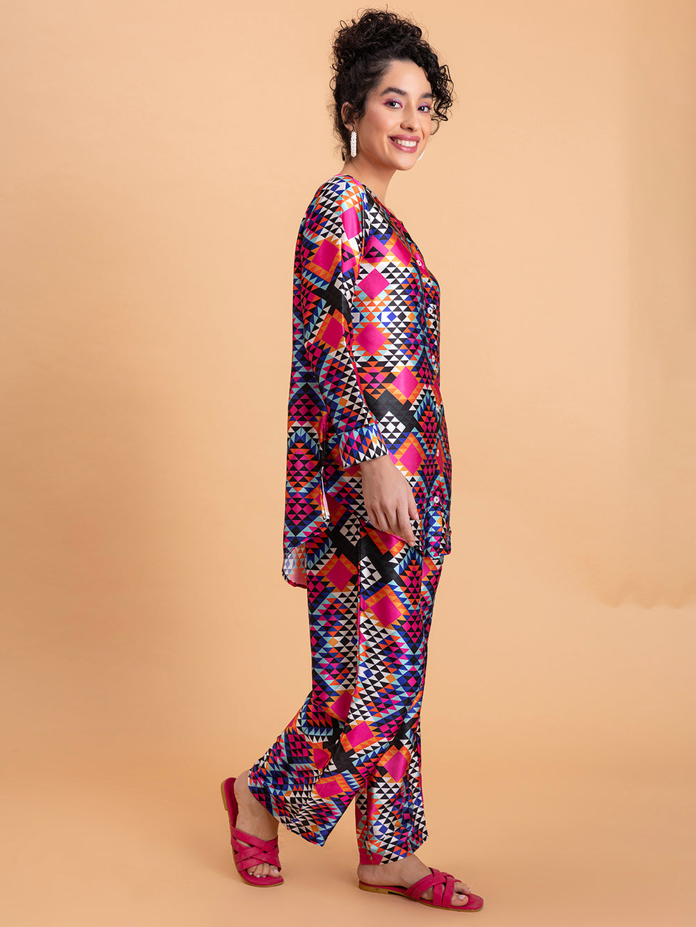 Side view of floral satin kurta and pant set