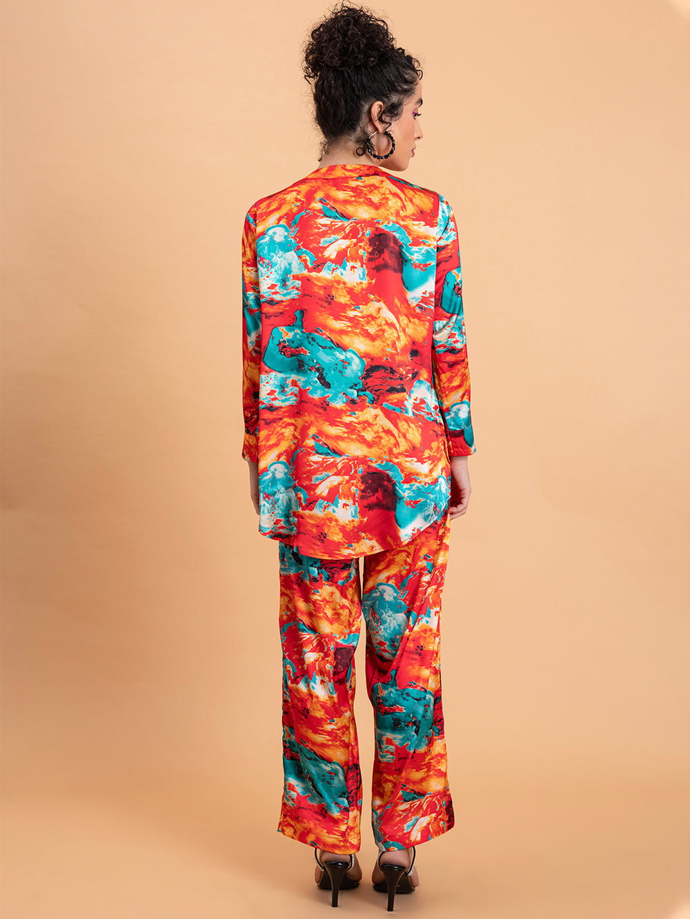 Side view of red satin kurta and pant set