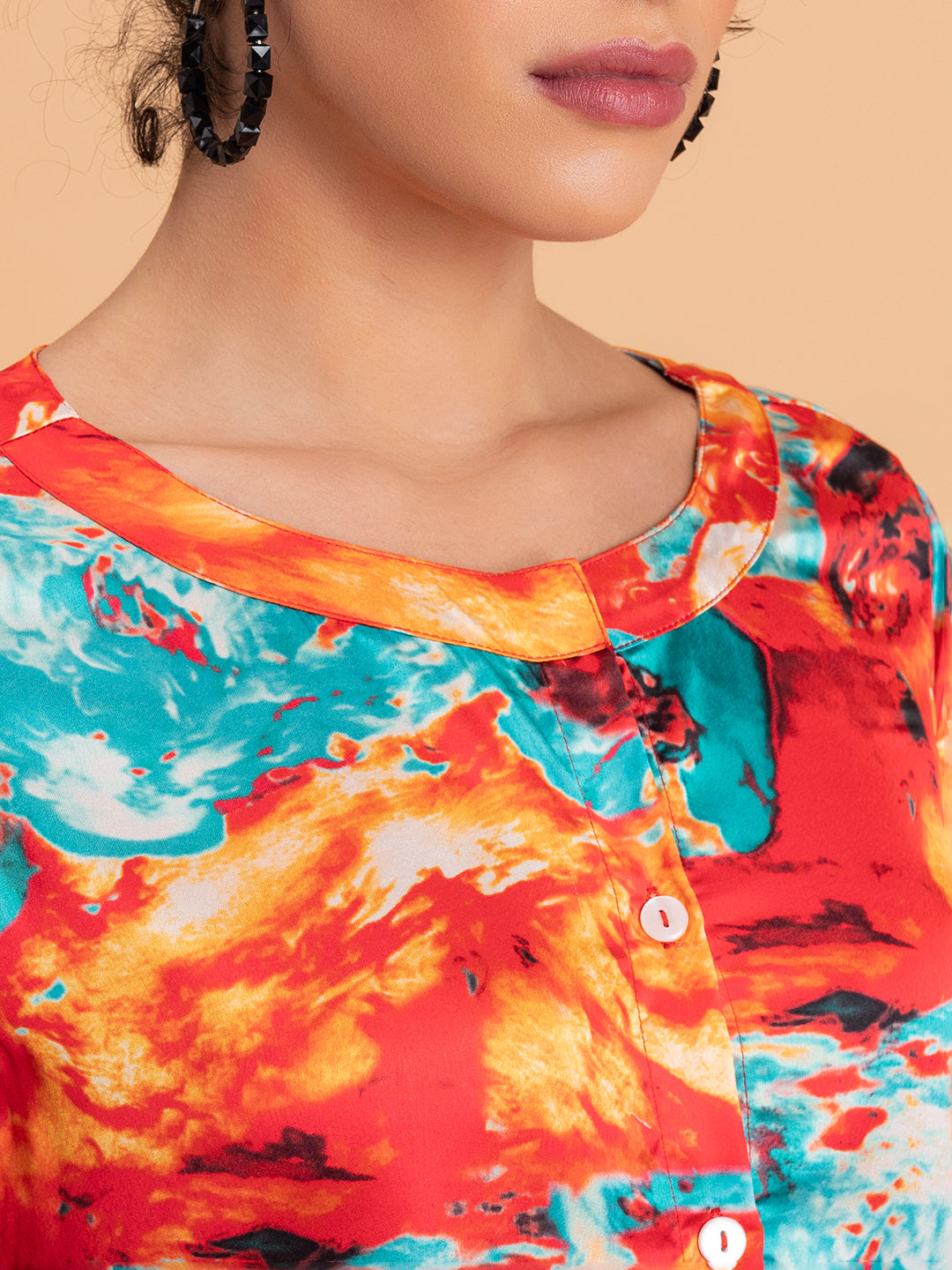 Detail of floral print on red satin kurta