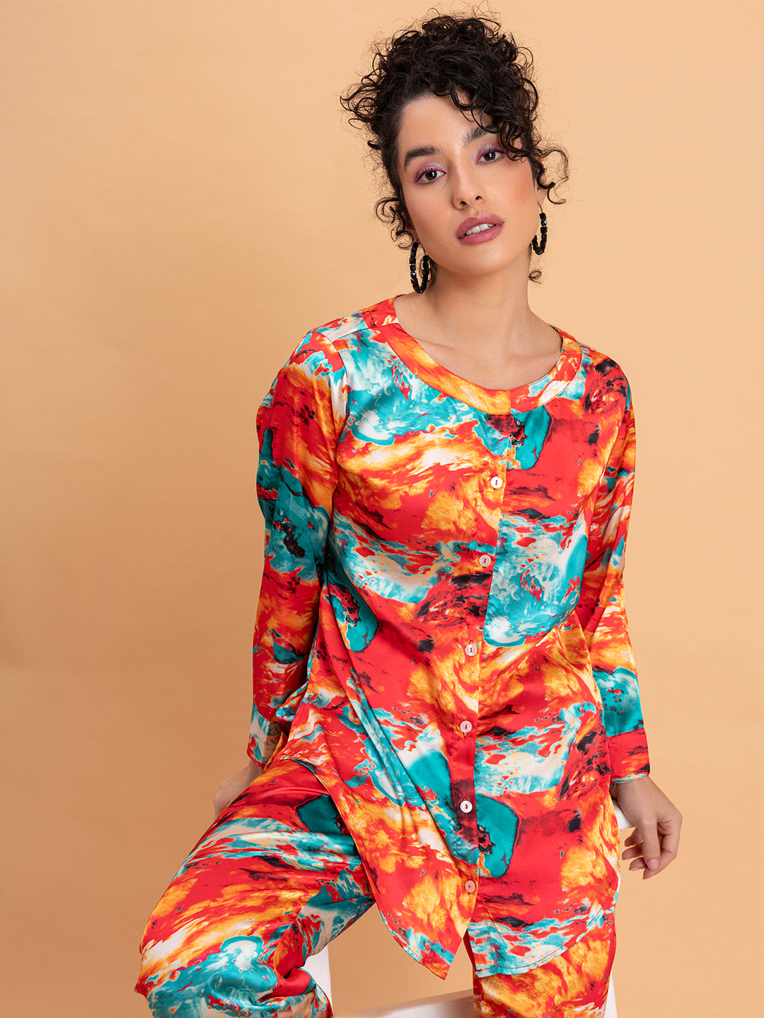 Lifestyle shot of model in red floral satin co-ord set