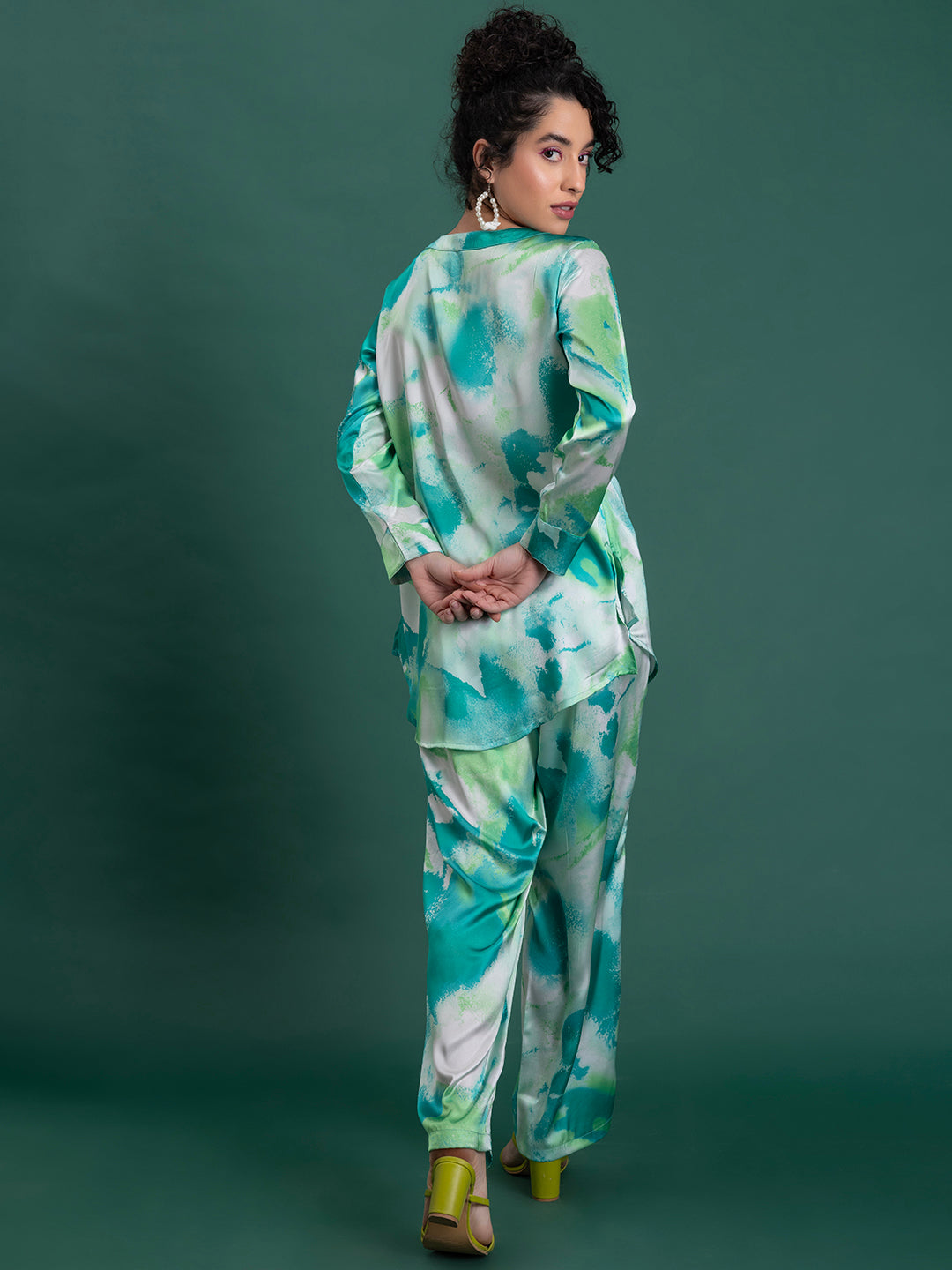 Close-up of floral print on green satin kurta co-ord fabric