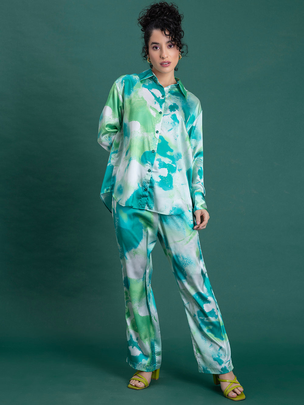 Side view of green printed satin co-ord top and trouser