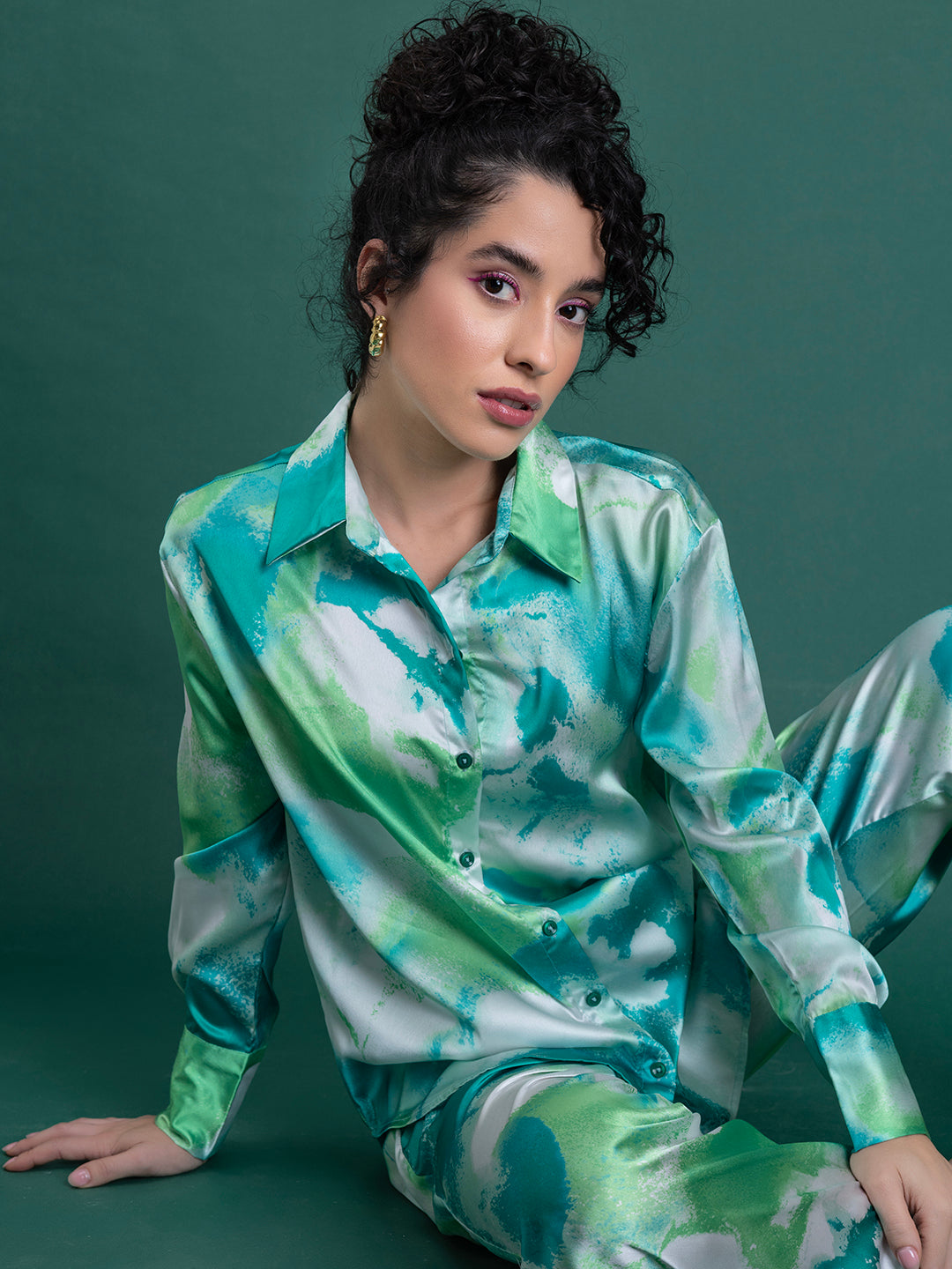 Close-up of floral print on green satin co-ord fabric