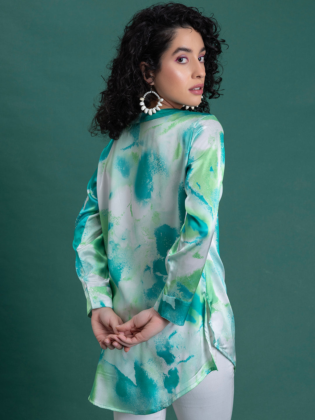 Hemline detail on green printed satin kurta-length shirt