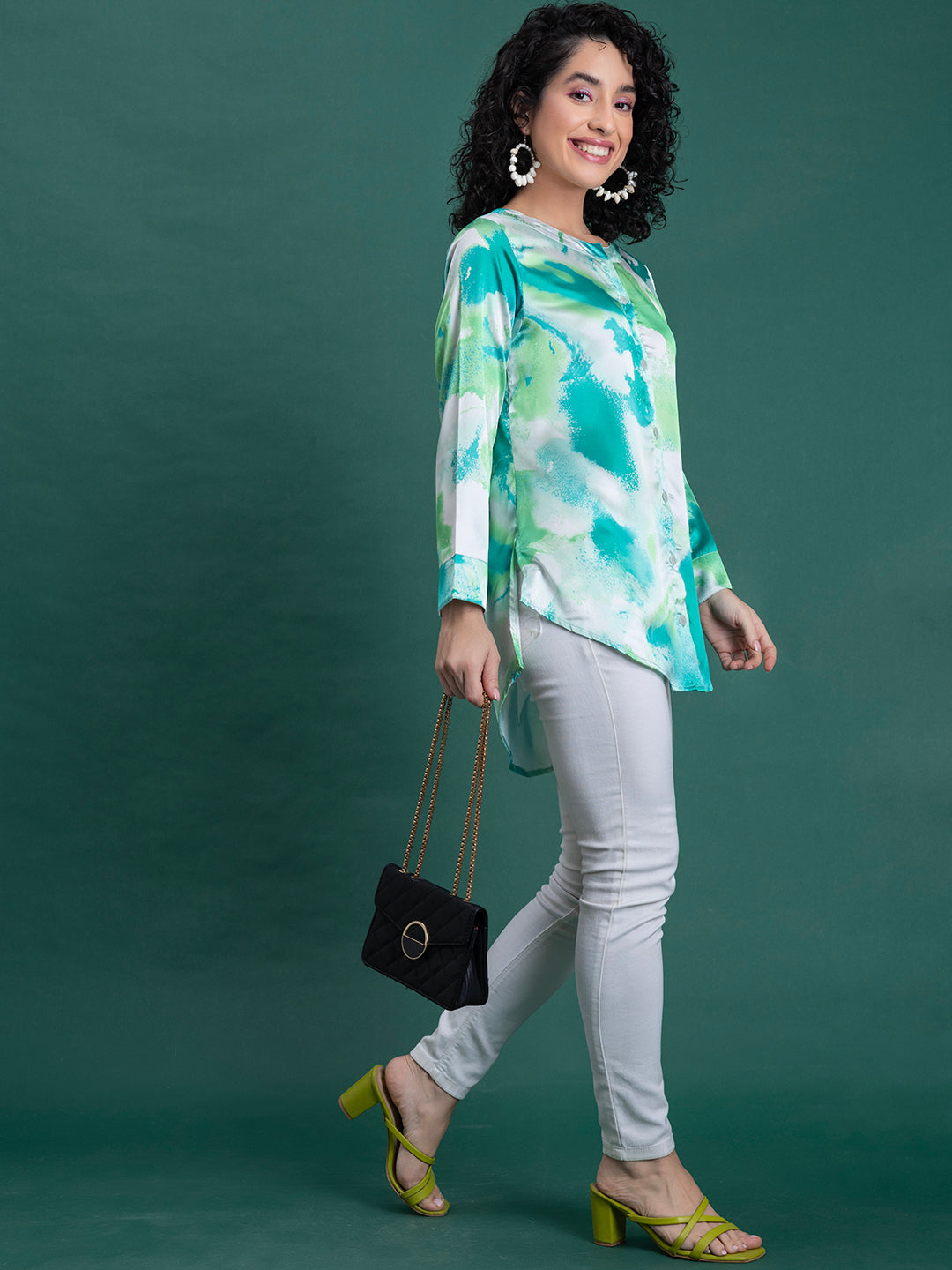 Close-up of floral print pattern on green satin kurta fabric