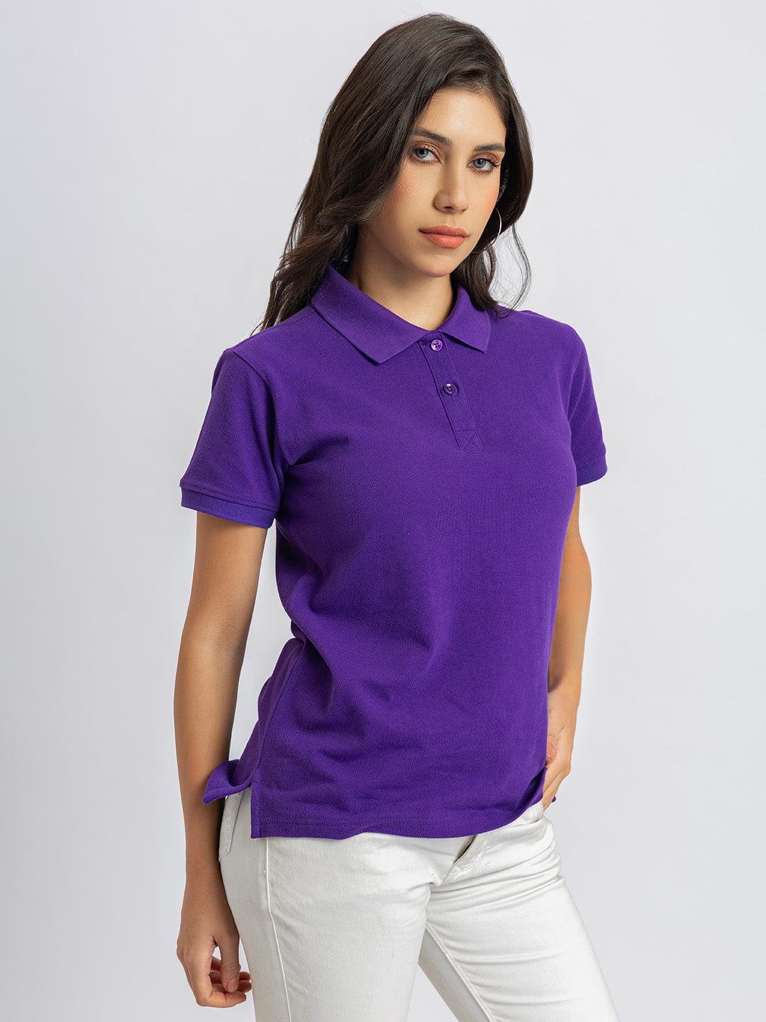 Lifestyle shot of woman wearing purple polo