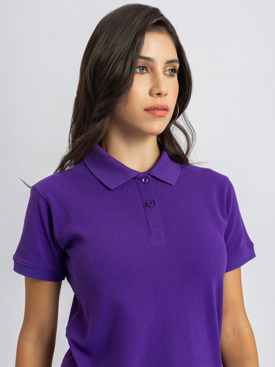 Styling shot of purple polo with denim