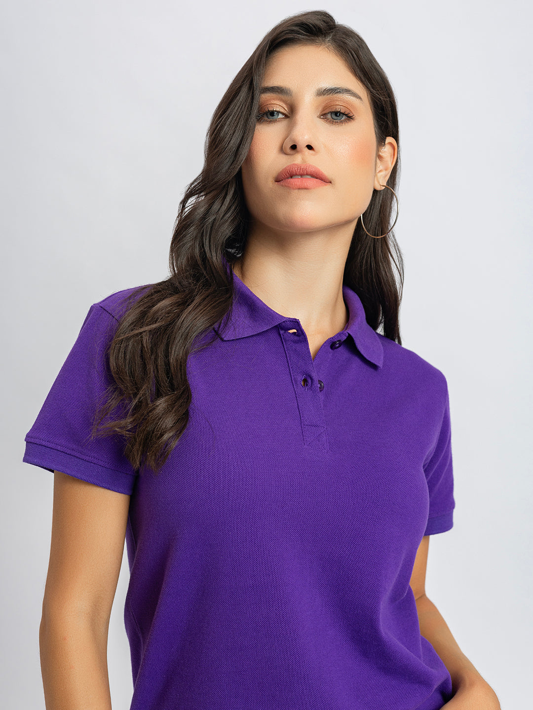 Folded purple cotton polo T-shirt detail