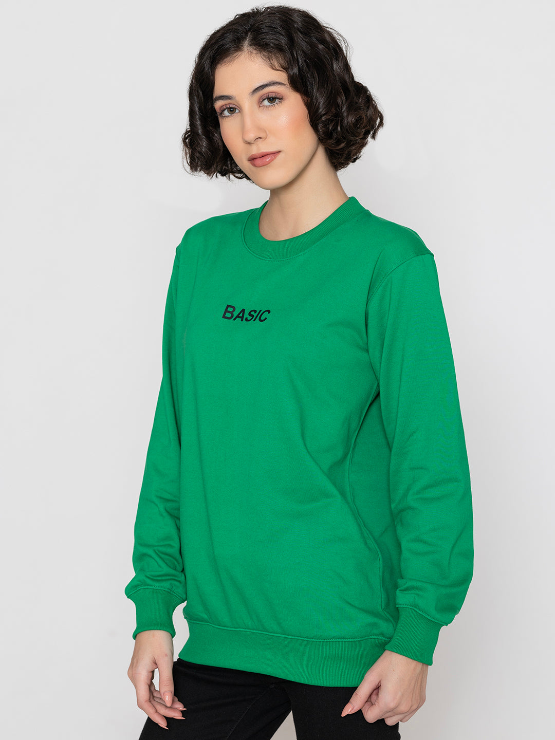 Close-up of ribbed cuff on green sweatshirt