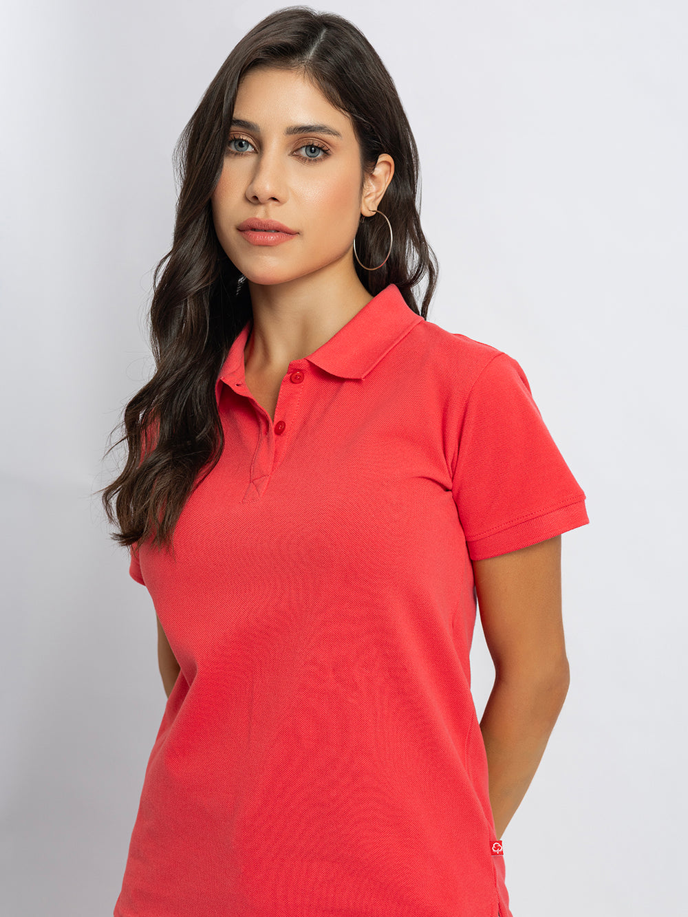 Side view of pink polo T-shirt with polo collar