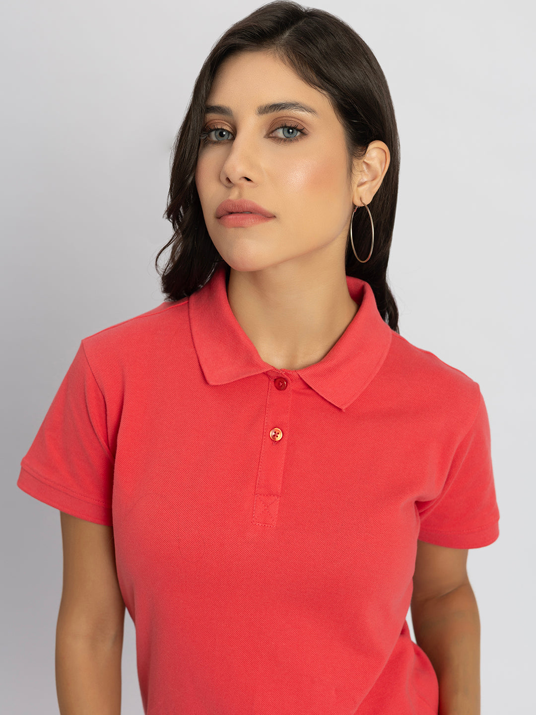 Folded pink cotton polo T-shirt detail