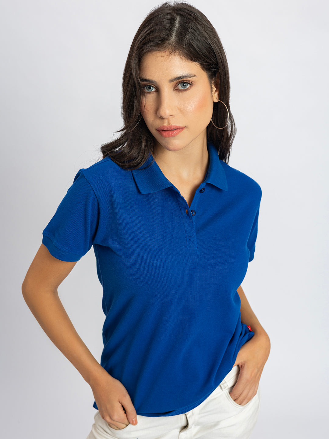 Detail of long sleeve cuff on royal blue cotton polo