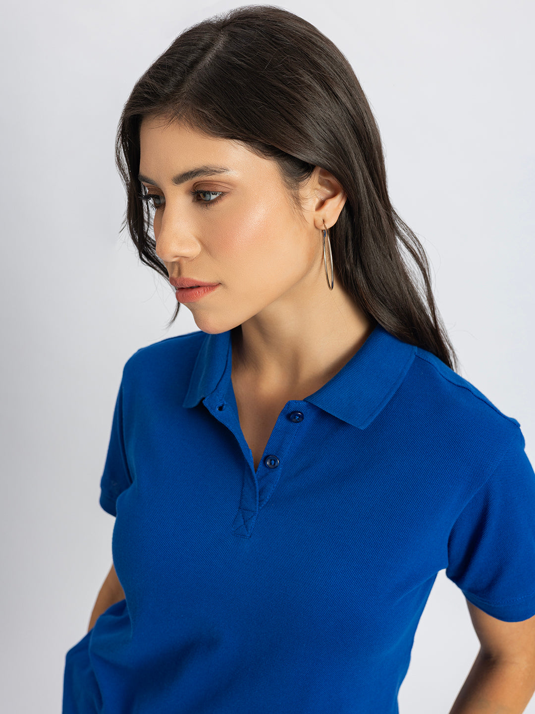 Styling shot of royal blue polo with chinos