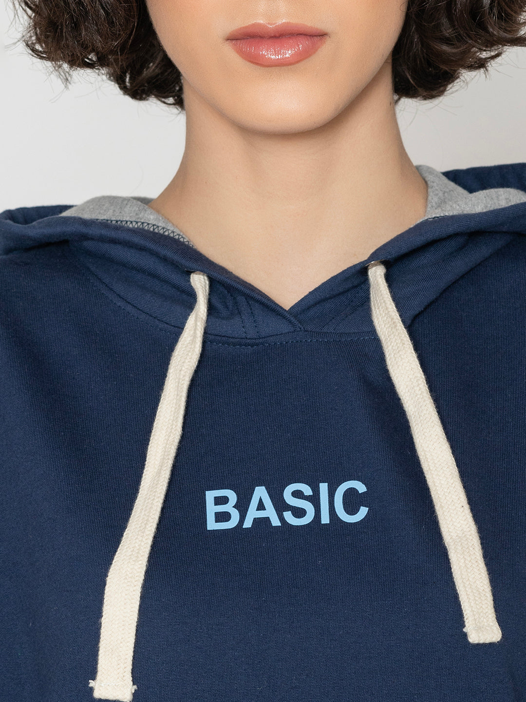 Close-up of kangaroo pocket on navy hoodie