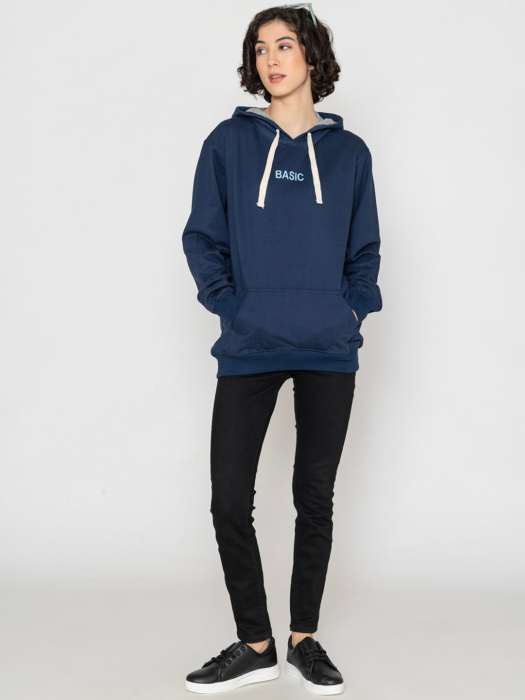 Detail of drawstring hood on navy hoodie