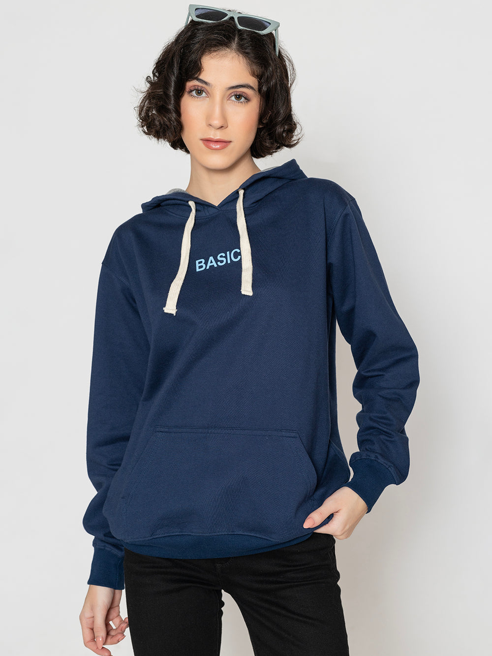 Side view of navy hoodie showing relaxed fit