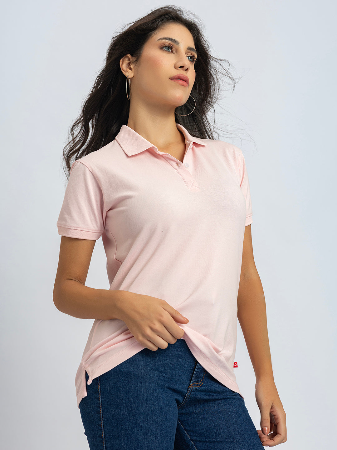 Detail of long sleeve cuff on light pink cotton polo