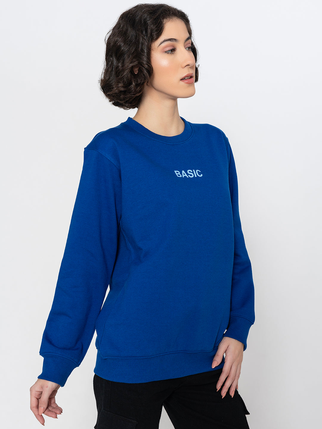 Lifestyle shot of blue sweatshirt styled with joggers
