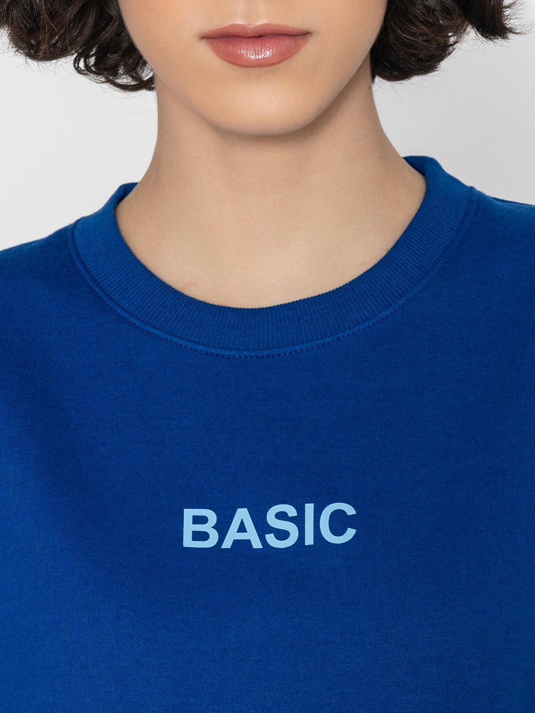 Close-up of ribbed cuff on blue sweatshirt