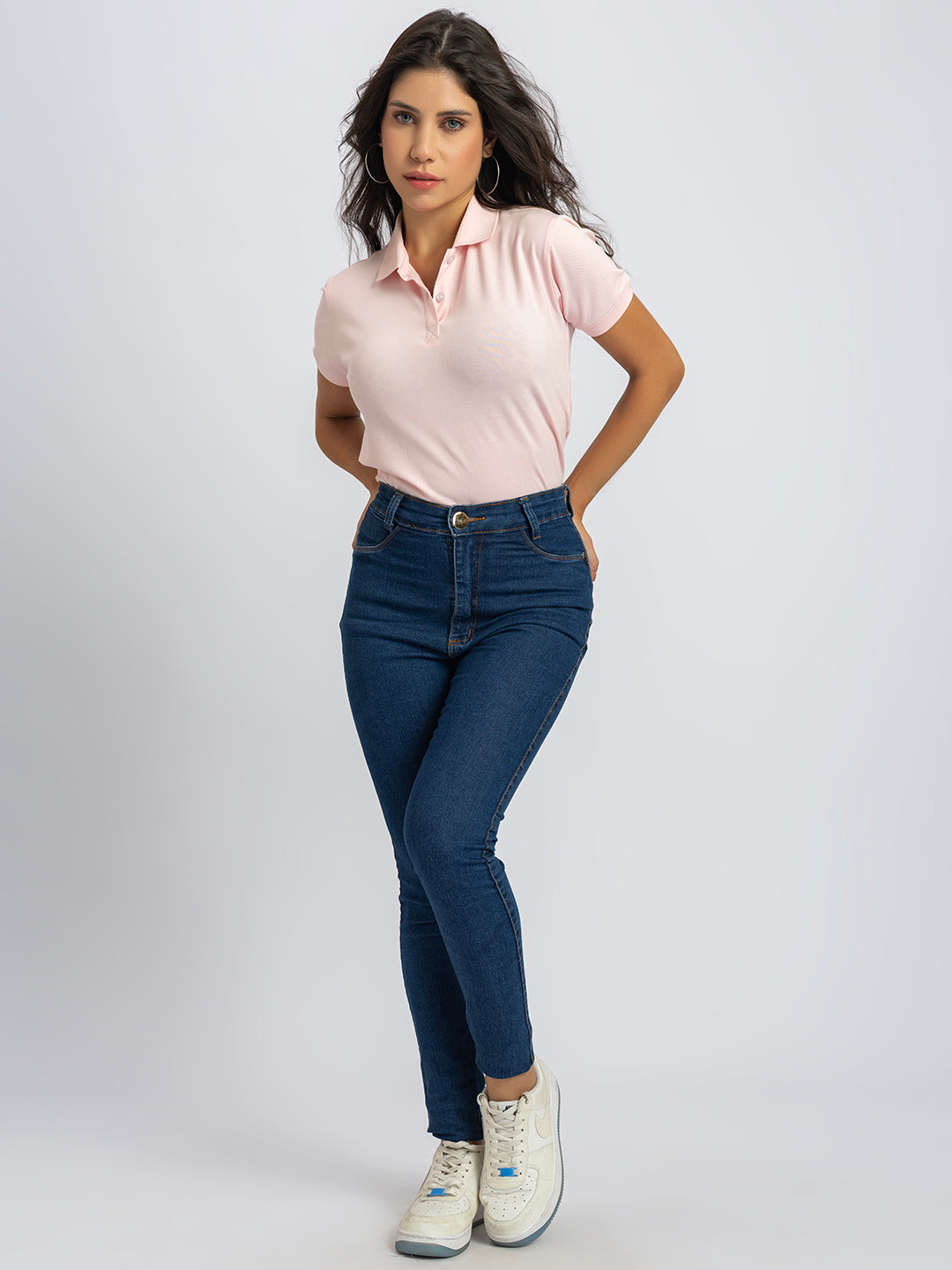 Close-up of polo collar on light pink cotton T-shirt