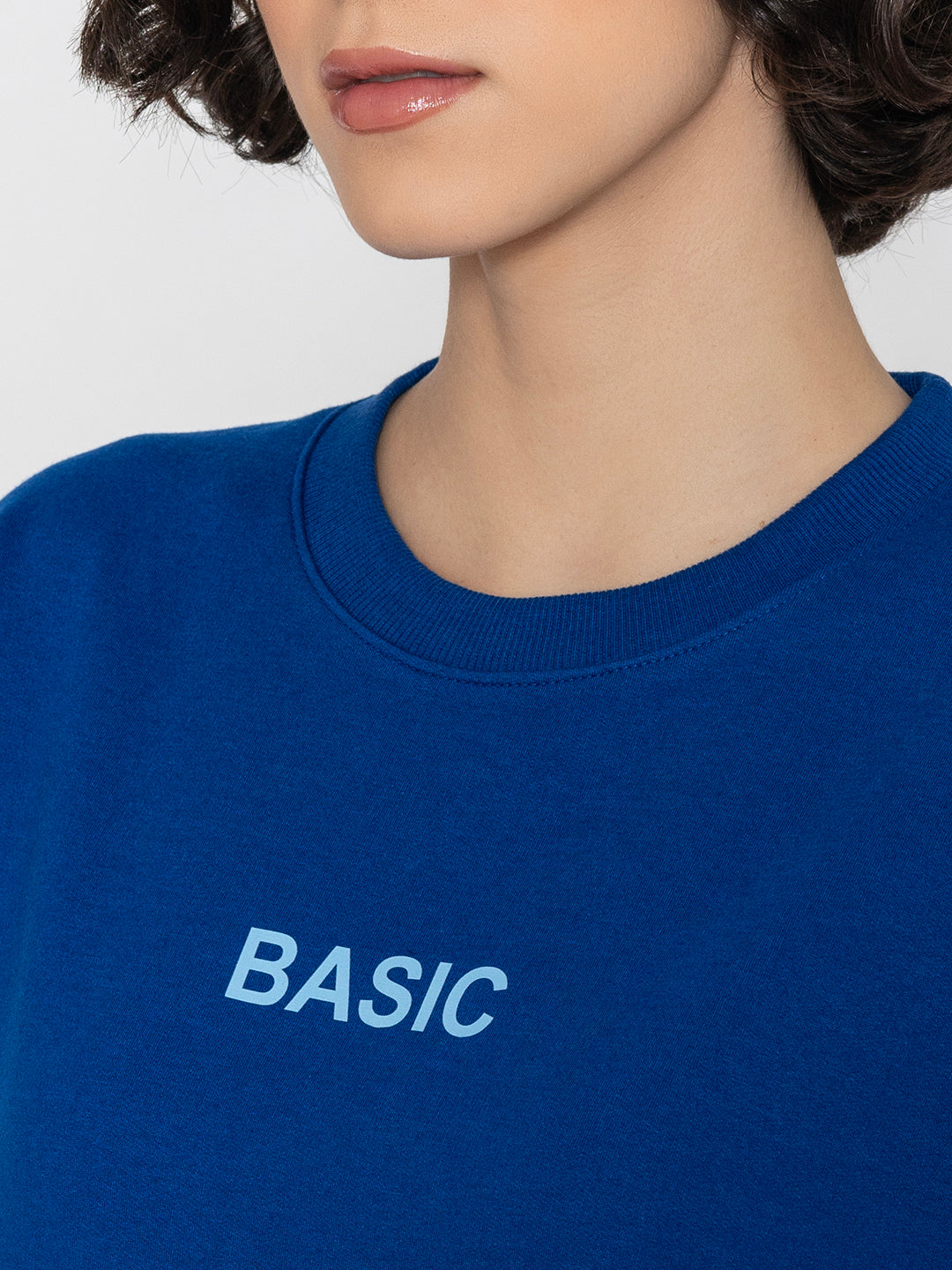 Detail of crew neck on blue cotton blend sweatshirt