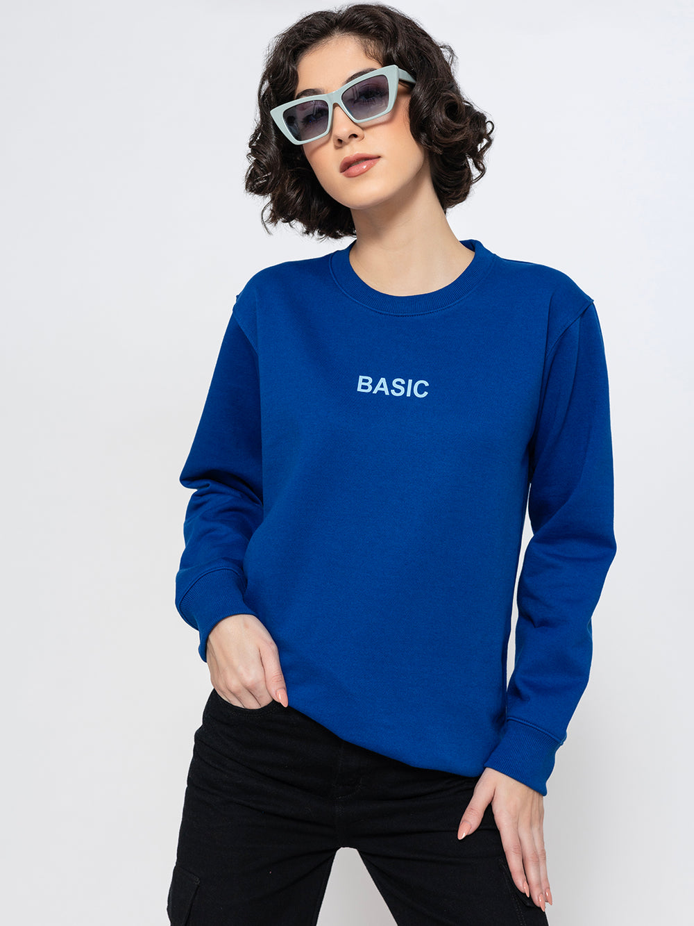 Side view of blue sweatshirt showing relaxed drop-shoulder fit