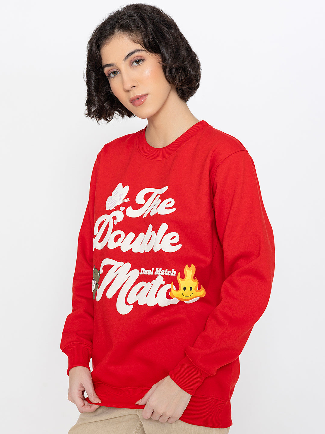 Lifestyle shot of red graphic sweatshirt with jeans