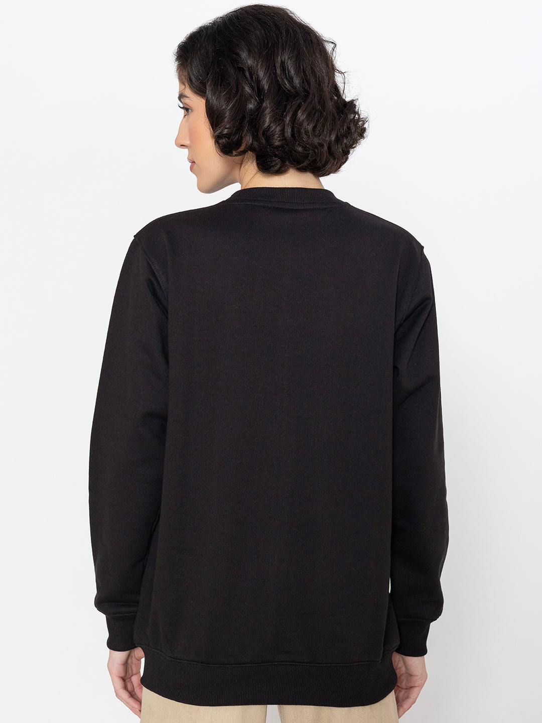 Black cotton sweatshirt shown in soft daylight