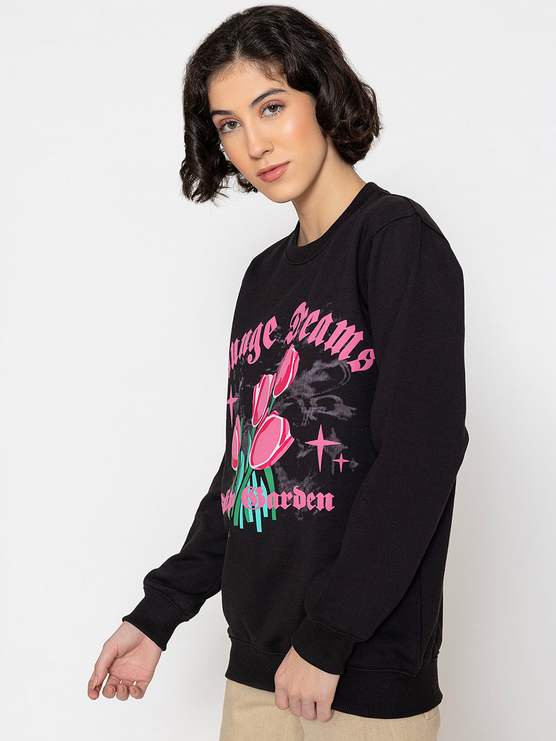 Lifestyle shot of black tulip sweatshirt with jeans