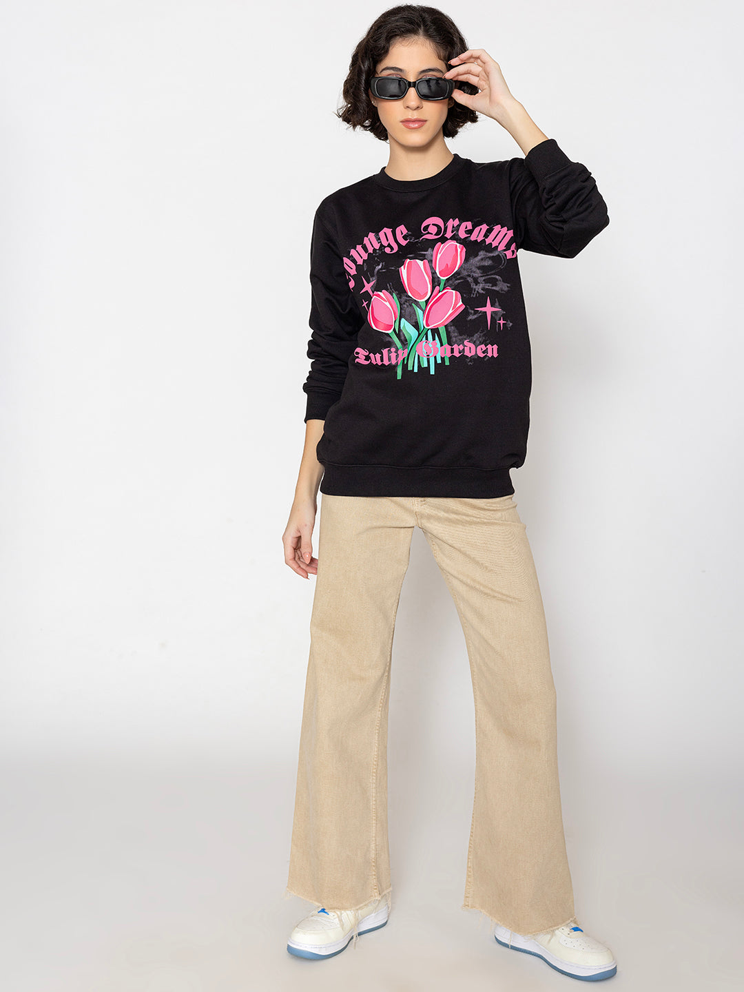 Detail of ribbed cuffs on black sweatshirt