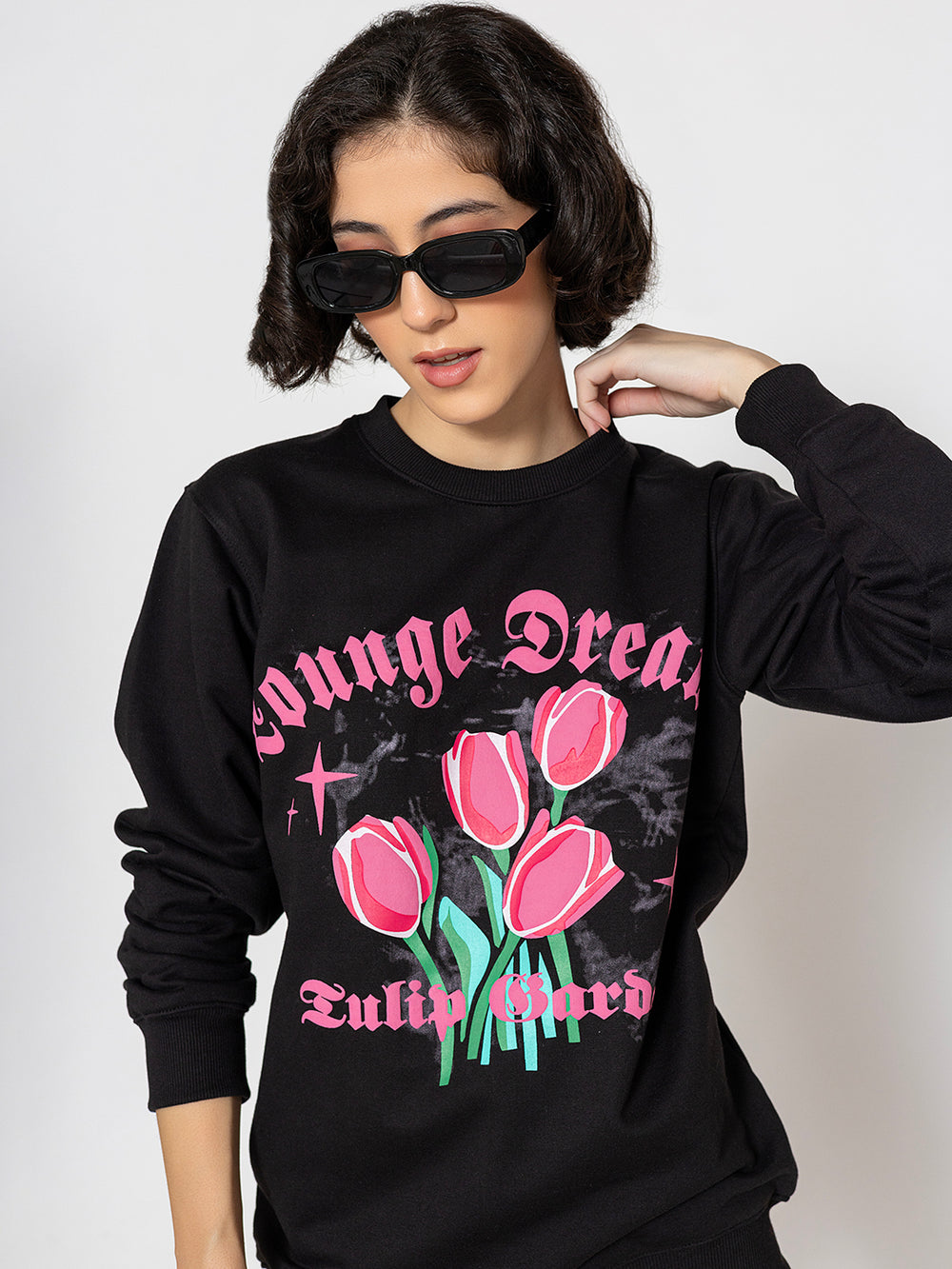 Side view of black sweatshirt with tulip print