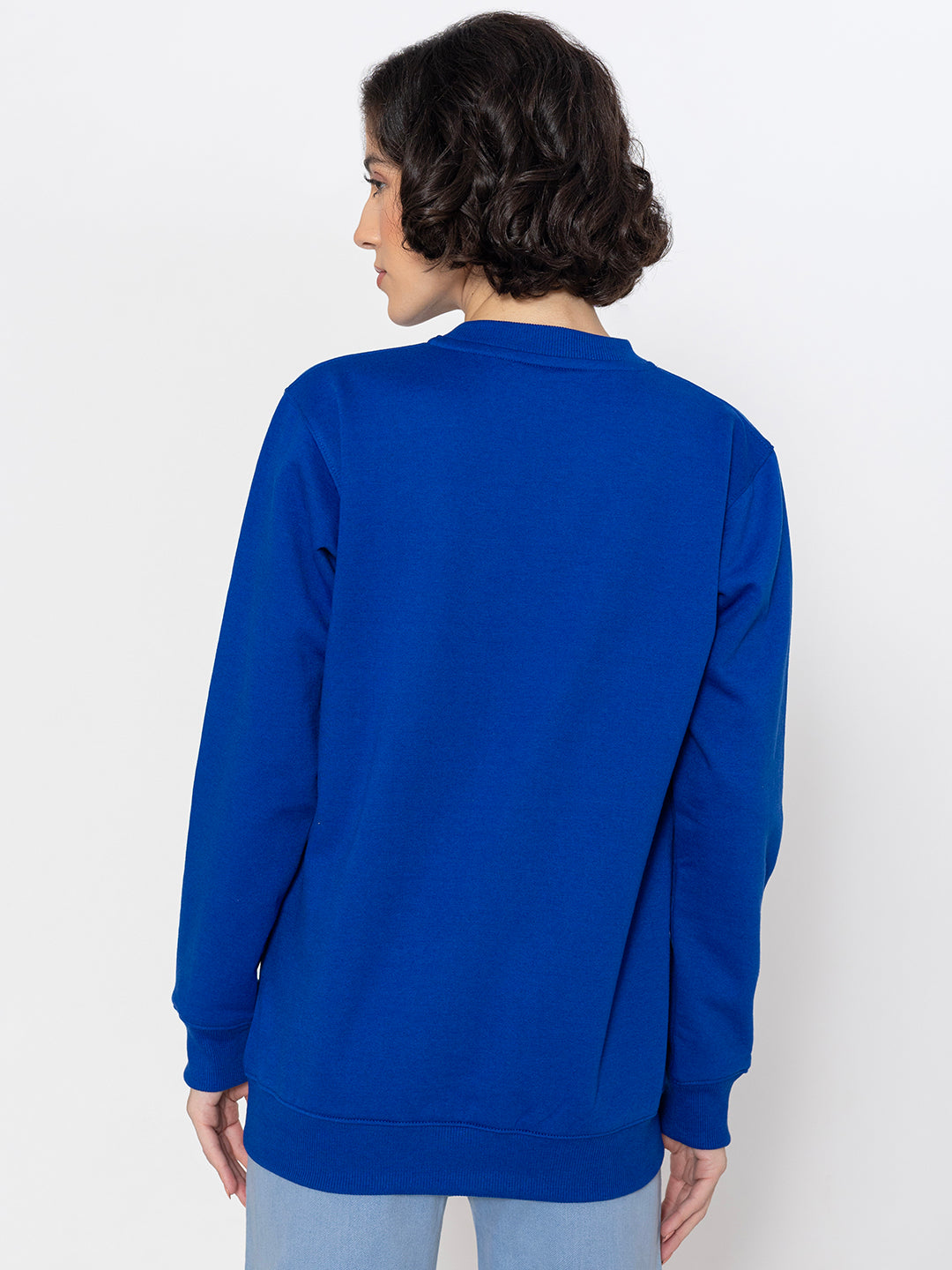 Blue cotton sweatshirt shown in soft daylight