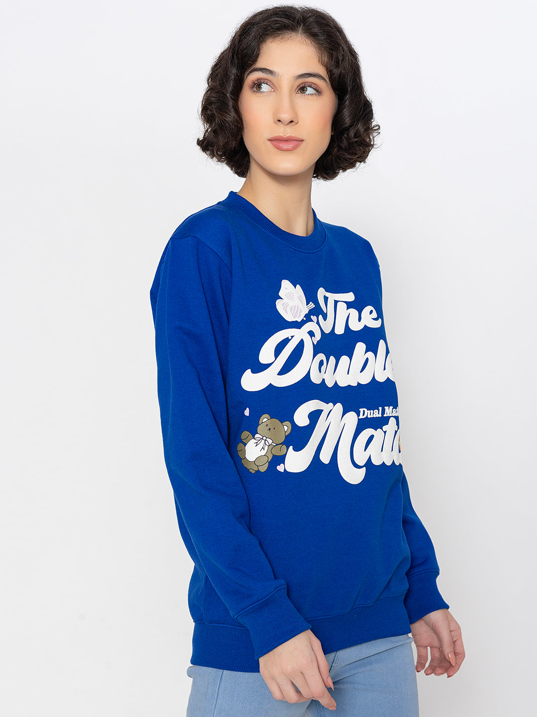 Close-up of statement graphic on blue sweatshirt