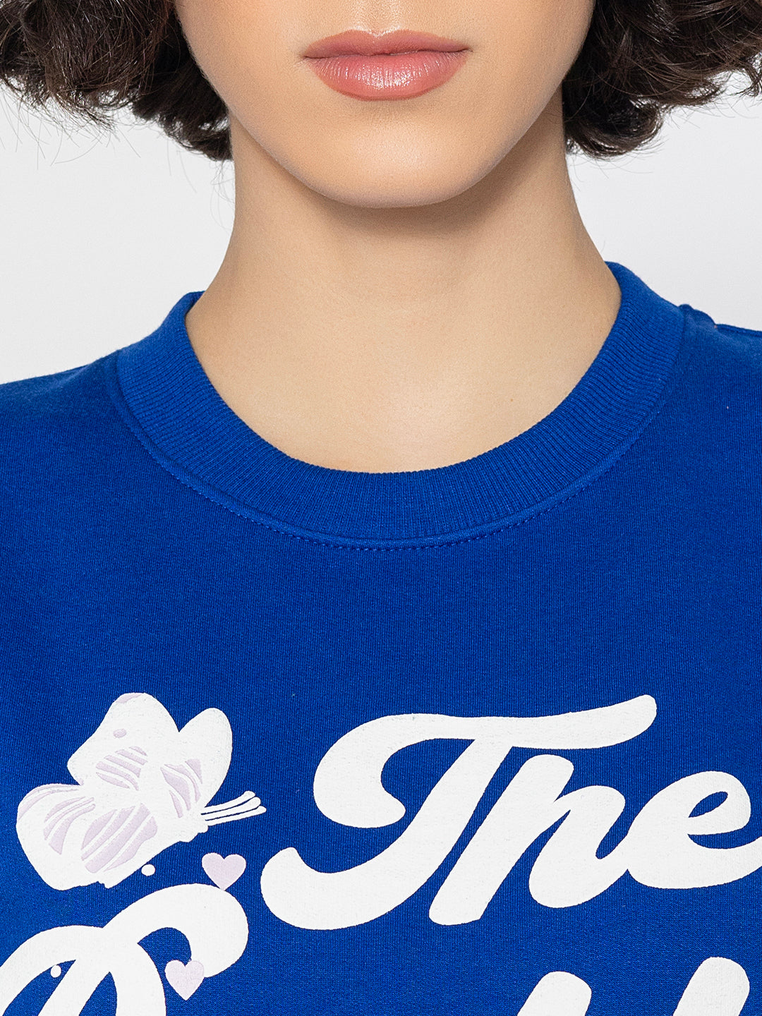 Lifestyle shot of blue print sweatshirt with jeans