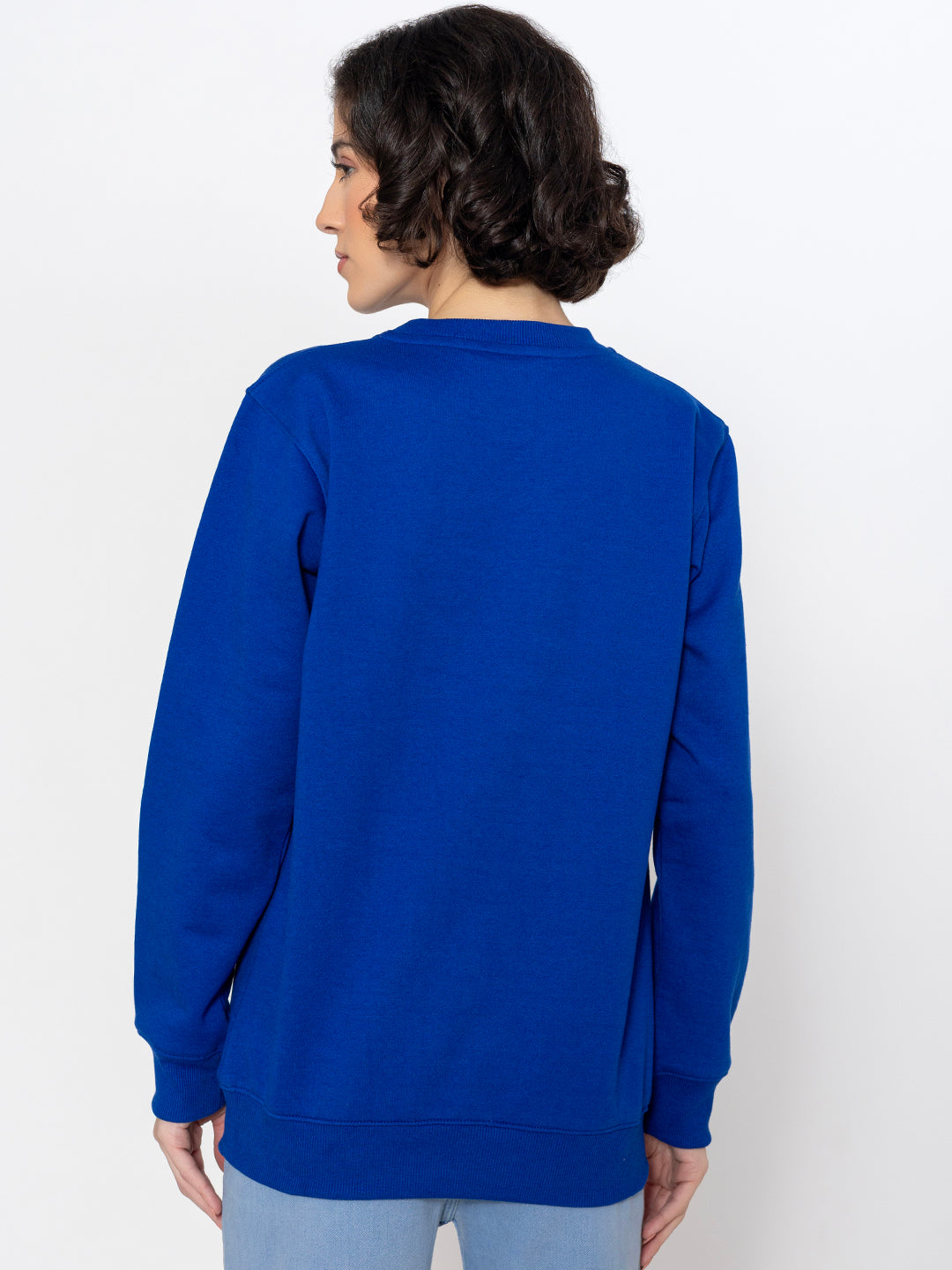 Blue graphic sweatshirt shown in soft daylight