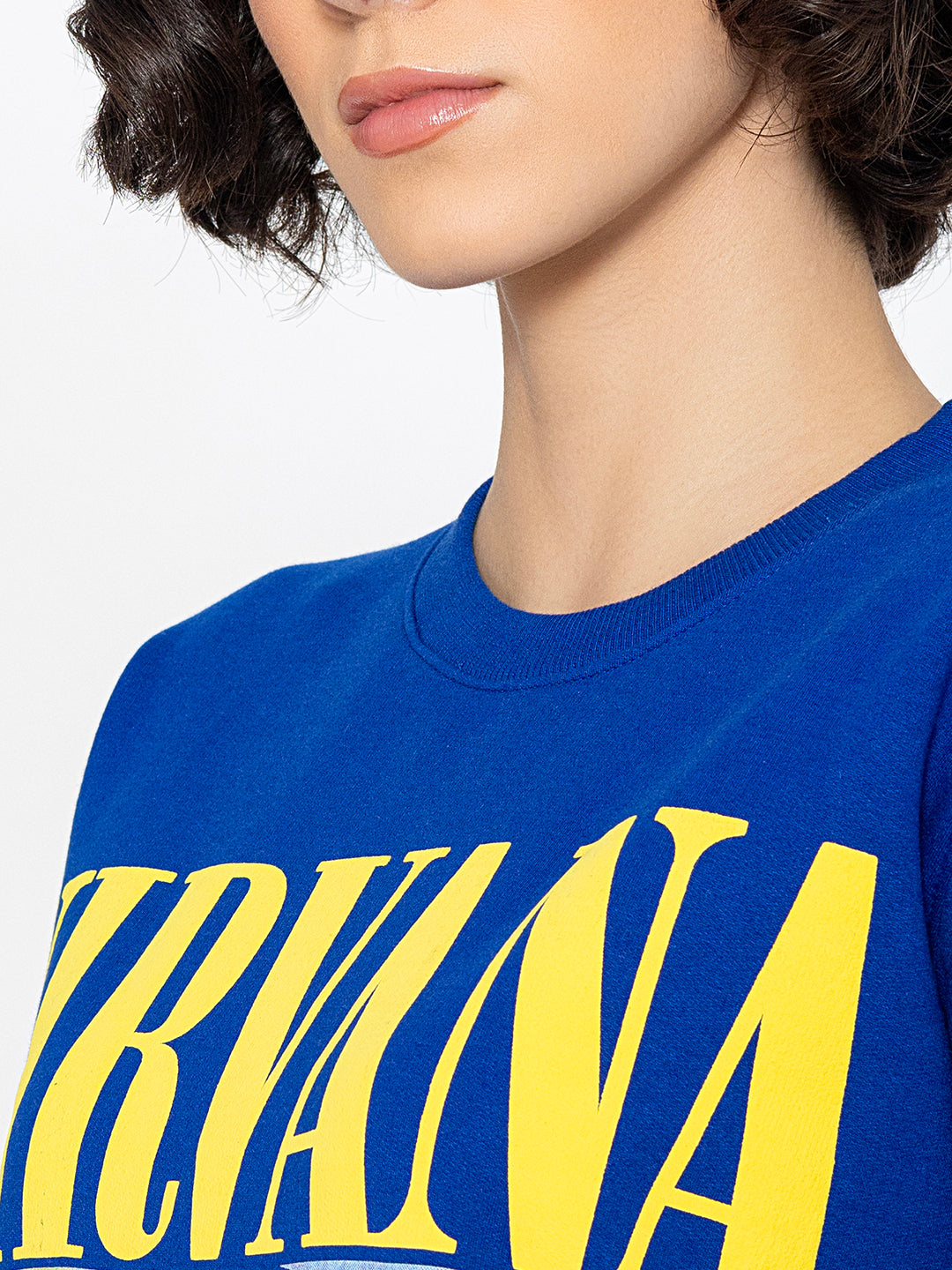 Detail of fleece texture on blue sweatshirt